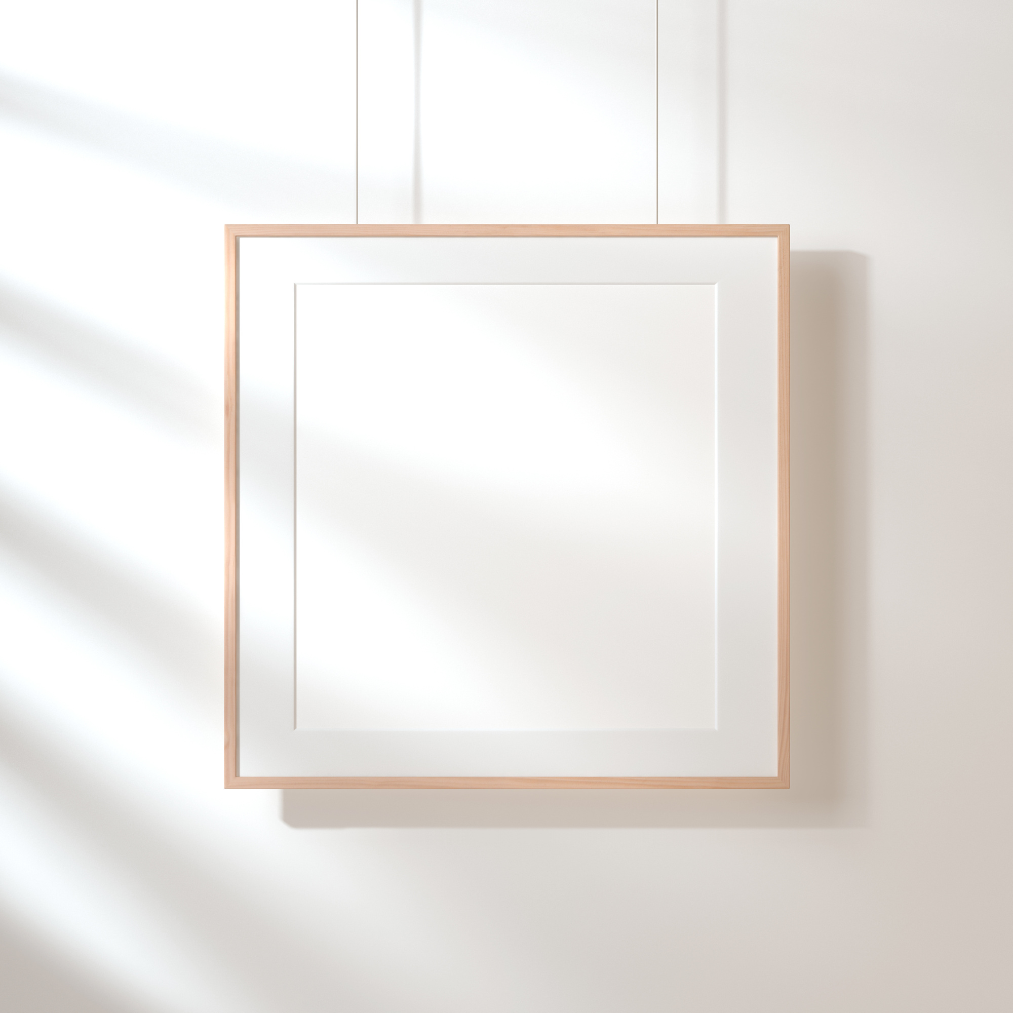 Square poster with wooden frame mockup hanging on the wall with shadows
